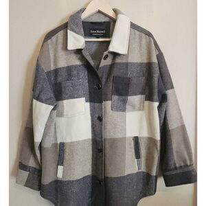 Jason Maxwell Outerwear Collection jacket with fringe trim on back.